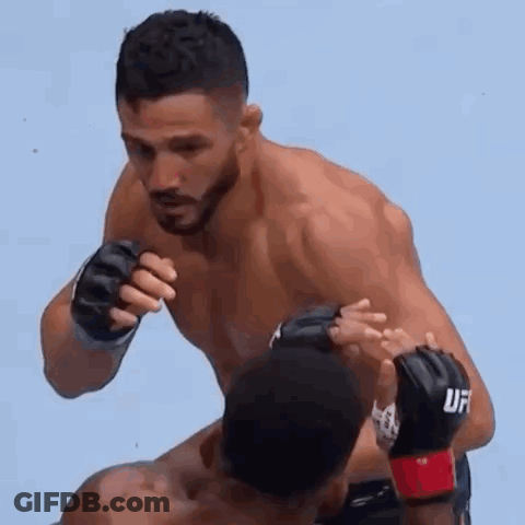 Man In UFC Glove Fighting Another Man In Wrestling Match GIF