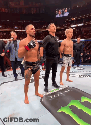 Man In UFC Glove In Front Of Monster Energy Sign GIF