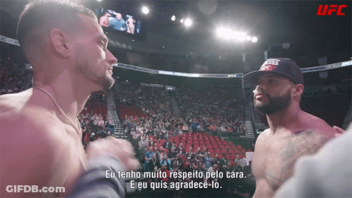 Man In UFC Hat Talking In Boxing Ring GIF