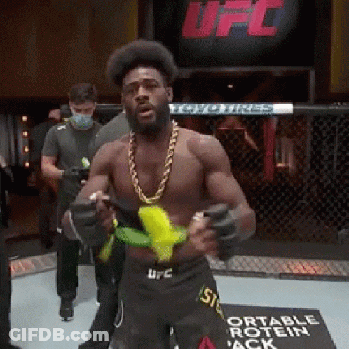 Man In UFC Ring Holding Banana GIF