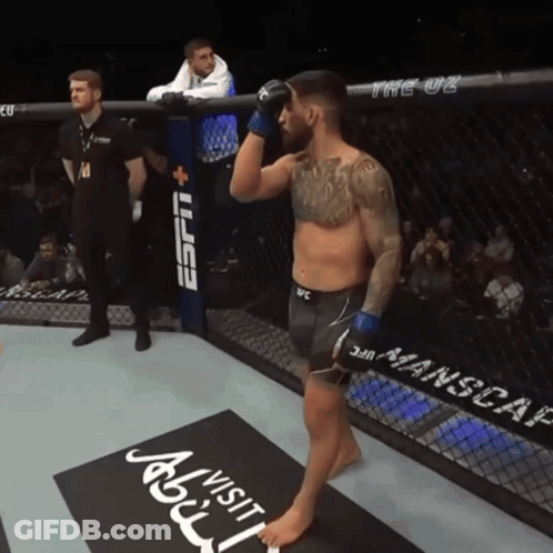 Man In UFC Ring In Front Of ESPN Banner GIF