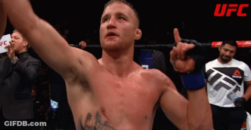 Man In UFC Shirt Holding Hand Up GIF
