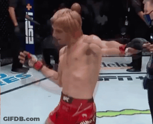 Man In UFC Shorts In Front Of ESPN Banner GIF