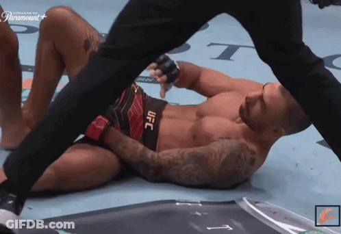 Man In UFC Shorts Laying On Floor GIF