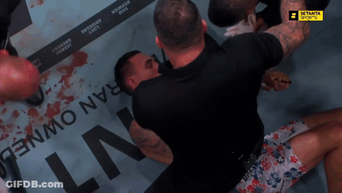 Man In UFC Shorts Lying On Ground GIF