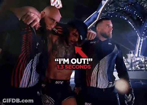 Man In UFC Uniform Helping Another GIF