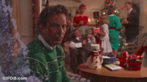 Man In Ugly Christmas Sweater By Tree GIF