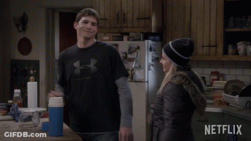Man In Under Armour Shirt Next To Woman GIF