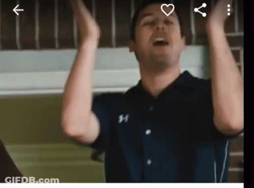 Man In Under Armour Shirt Raising Hands GIF