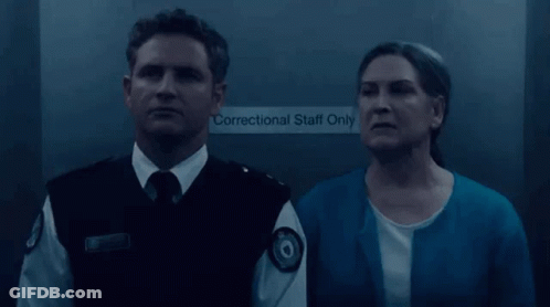 Man In Uniform Standing Before Personal Staff Only Door GIF