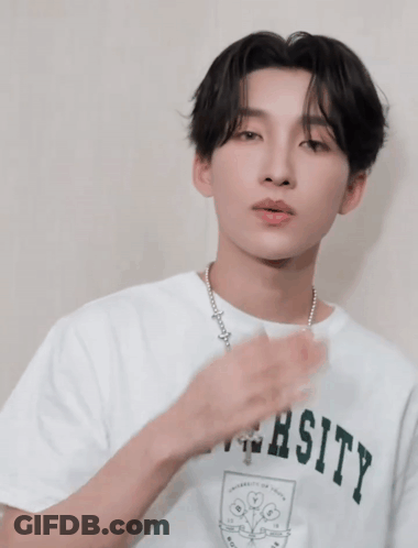 Man In University T-Shirt With Necklace GIF