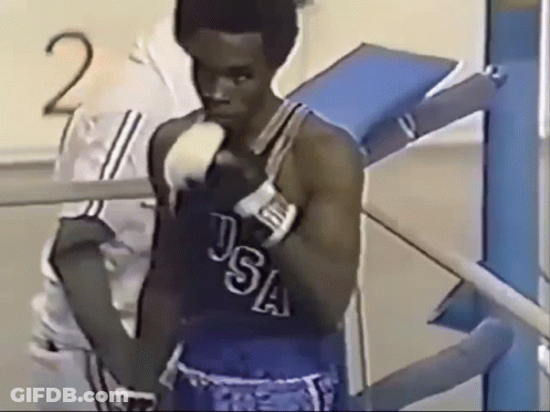 Man In USA Boxing Uniform Standing In Front Of Number 2 GIF
