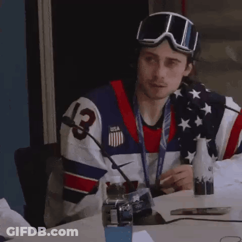 Man In USA Jersey And Goggles At Table GIF