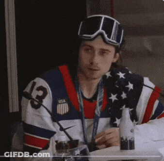 Man In USA Jersey And Goggles Sitting GIF