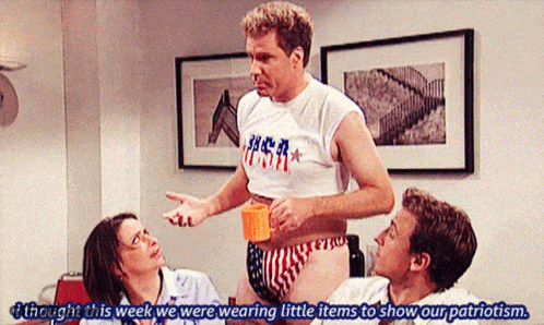 Man In USA Shirt Talking To Woman And Two Men GIF