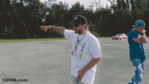 Man In USA T-Shirt In Parking Lot GIF