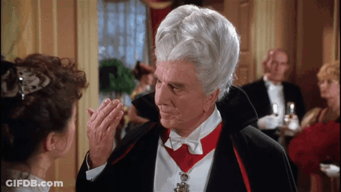 Man In Vampire Costume Looking At Woman GIF