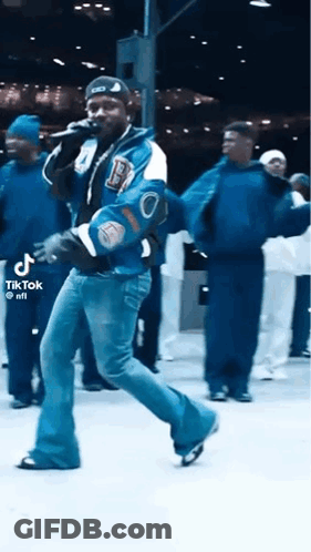 Man In Varsity Jacket Singing And Dancing GIF