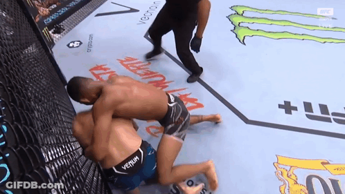 Man In Venom Shirt Wrestling Another Man GIF