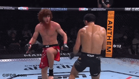 Man In Venum Shorts Kicks Another Man In Ring GIF
