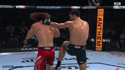 Man In Venum Shorts Kicks Man In Red Shorts GIF