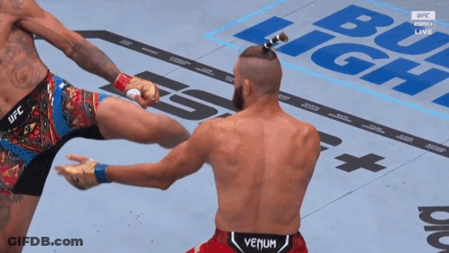 Man In Venum Shorts Kicks Man In UFC Shorts GIF