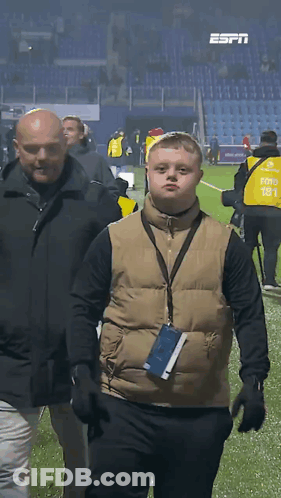Man In Vest 181 Walking On Field GIF
