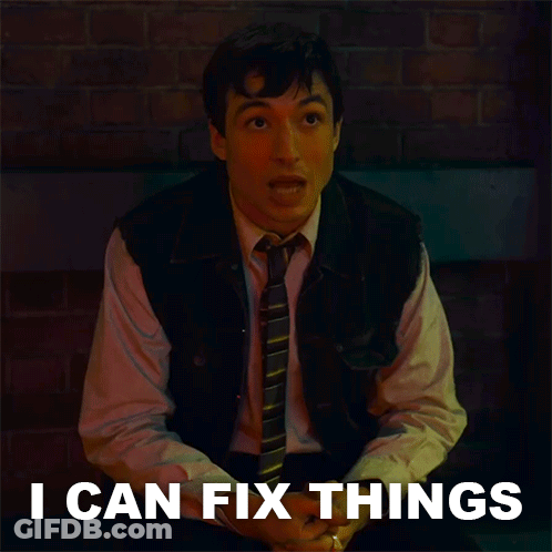 Man In Vest And Tie Beside I Can Fix Things Sign GIF
