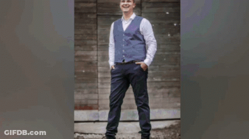 Man In Vest And Tie Holding Guitar GIF