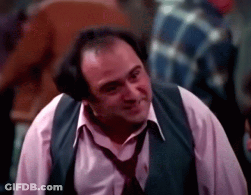 Man In Vest And Tie Smiling GIF