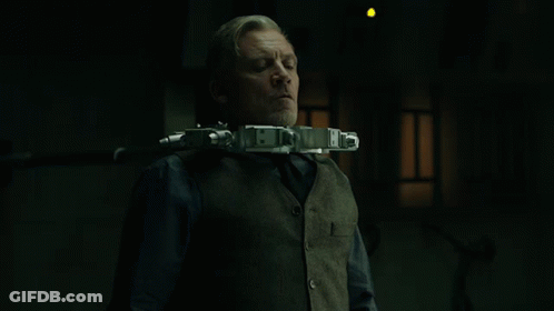 Man In Vest And Tie With Gun Neck Device GIF
