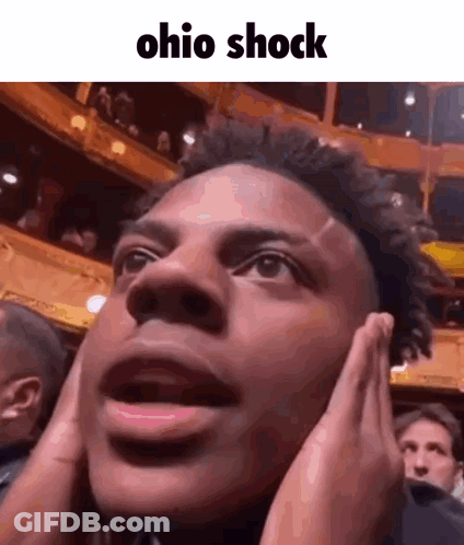Man In Vest And White Shirt Asking Who Is He GIF