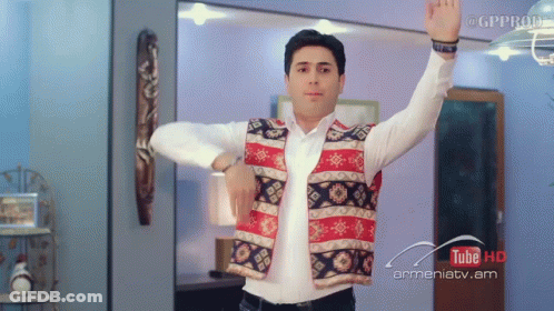 Man In Vest Dancing In Front Of YouTube HD Sign GIF