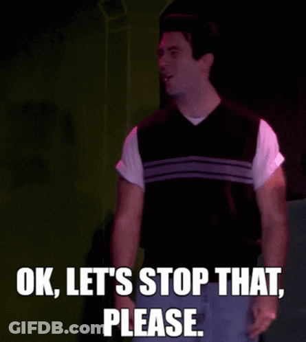 Man In Vest On Stage Saying Ok Let's Stop That Please GIF
