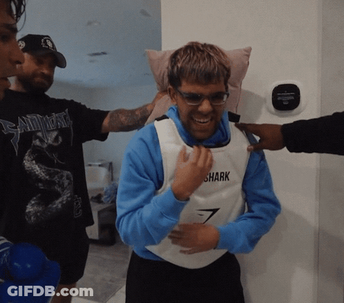 Man In Vest Saying Shark Smiling GIF