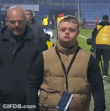 Man In Vest With Number 181 Next To Boy GIF