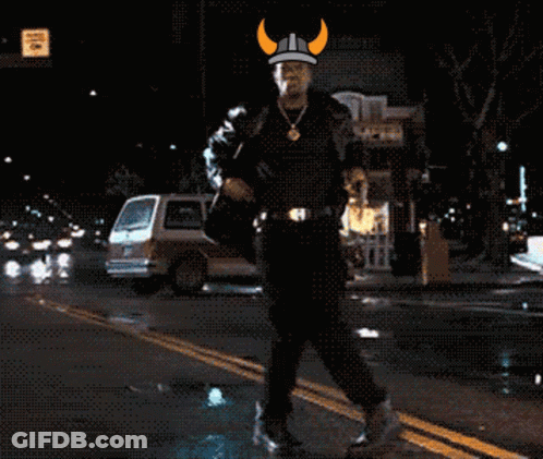 Man In Viking Hat Walking Down Street GIF