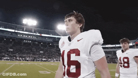 Man In Vikings Jersey Holding Hand To Head GIF