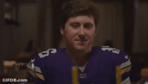 Man In Vikings Jersey Holding Head GIF