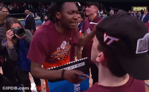 Man In Virginia Tech T-Shirt Talking To Another Man GIF