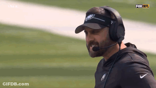 Man In Visor And Headphones With Fox NFL Logo GIF