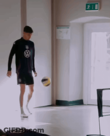 Man In Volkswagen Shirt Kicking Ball GIF