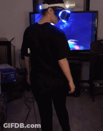 Man In VR Headset Sitting In Front Of TV GIF