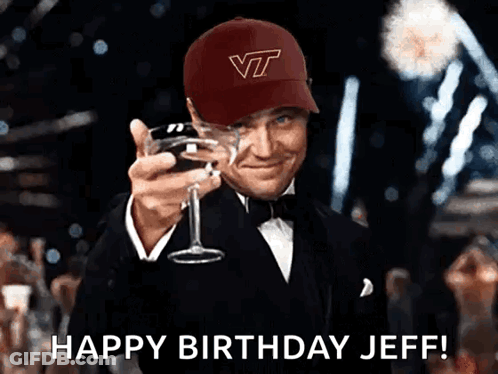 Man In VT Hat Holding Wine Glass GIF