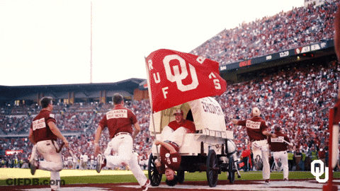 Man In Wagon With OU Flag GIF