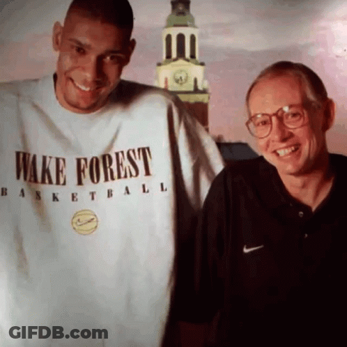 Man In Wake Forest Shirt Next To Man With Glasses GIF