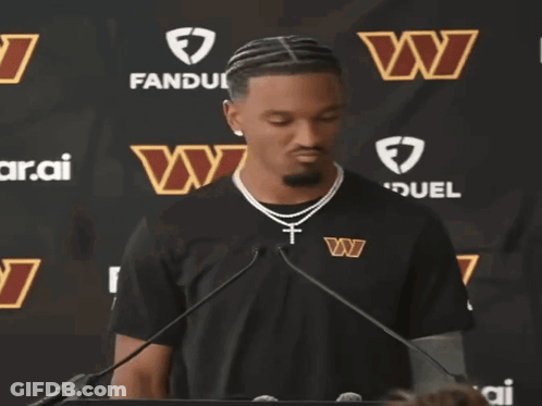 Man In Washington Redskins Shirt At Microphone GIF