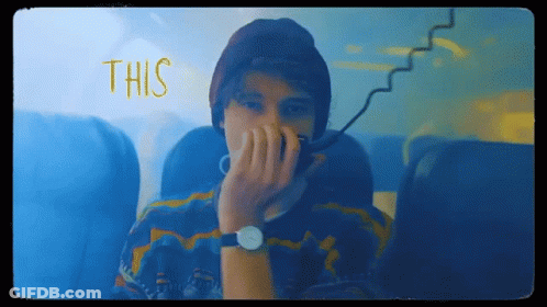 Man In Watch And Beanie Covering Face Saying This GIF