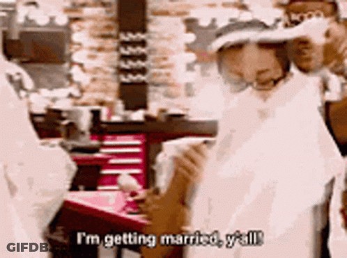 Man In Wedding Dress Talking To Woman In Wedding Dress GIF