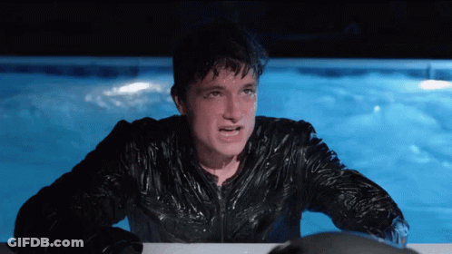 Man In Wet Jacket In Pool At Night GIF